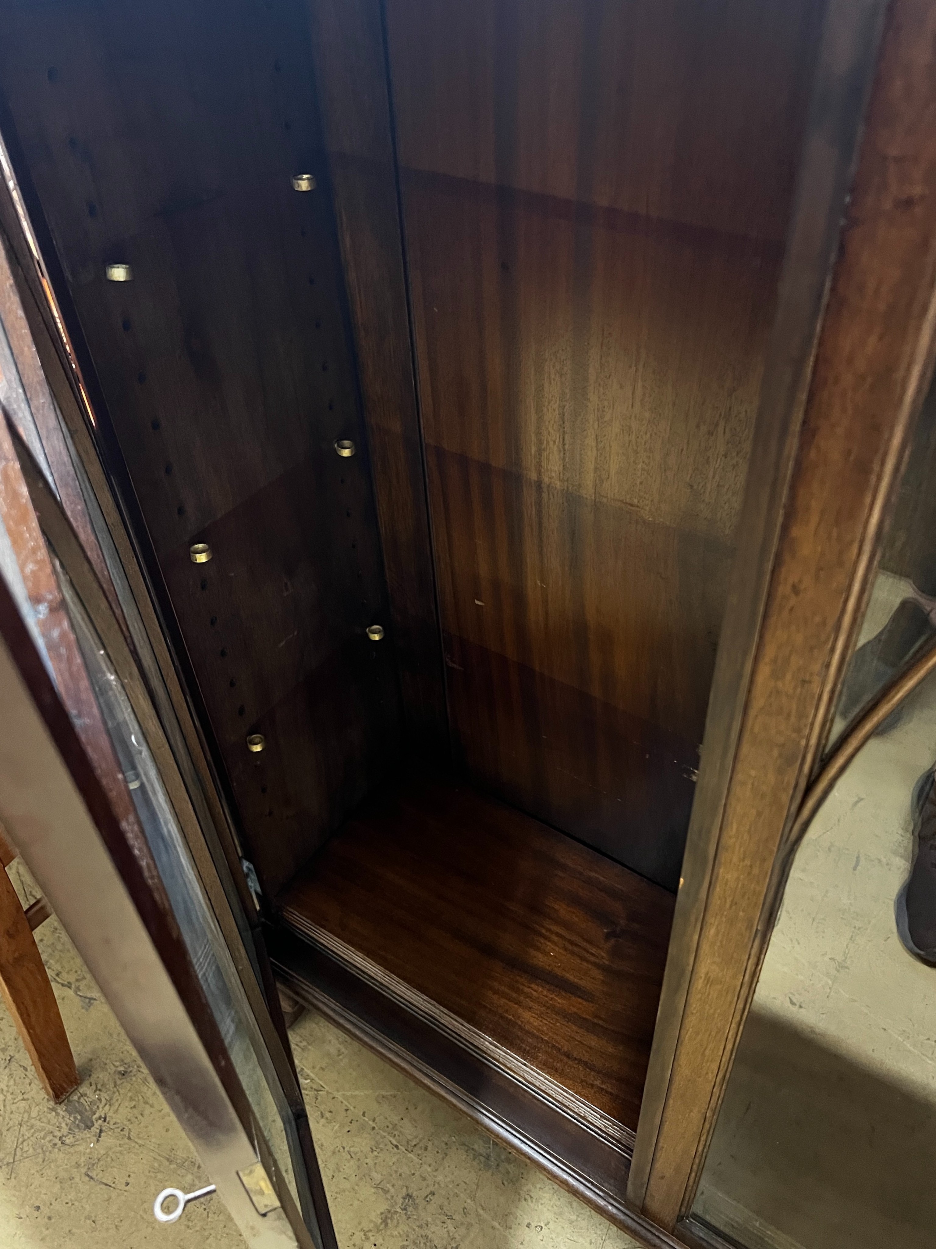 An early 20th century George III style mahogany bookcase, width 132cm, depth 29cm, height 108cm